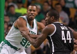 Boston, MA  -    Boston Celtics center Jason Collins battles with Brooklyn Nets forward James Mays in the paint at TD Garden on Tuesday, October 16, 2012. Staff Photo by Matthew West.